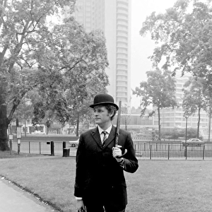 Bowler-hatted City gent in a park