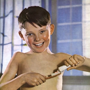 A boy cleaning his teeth