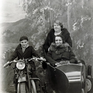 Boy & ladies on a 1929 Coventry Eagle in a studio