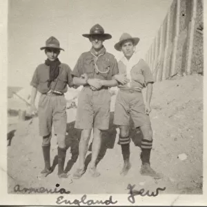 Three boy scouts arm in arm, Egypt
