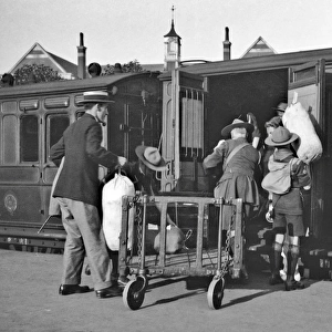 Boy scouts boarding a railway train