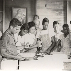 Boy scouts cooking at camp, British Honduras