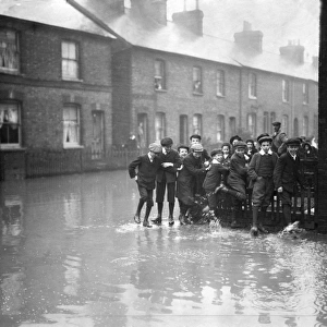 Boys having fun during Medway floods, Kent
