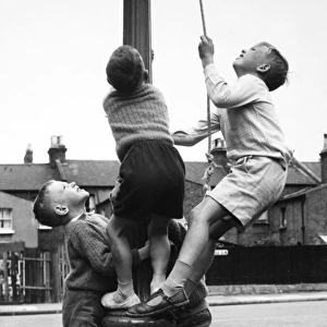 Boys on a lamp post on a Balham street, SW London