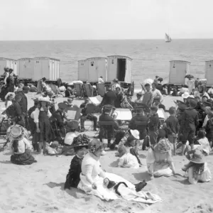 Print of a brass band performing on Walton-on-the-Naze beach, circa 1910 Print of a brass band performing on Walton-on-the-Naze beach, circa 1910