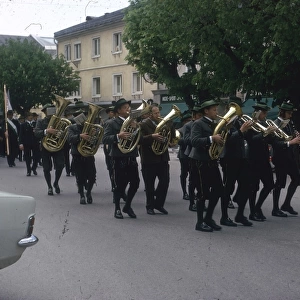 Brass band marching along a street