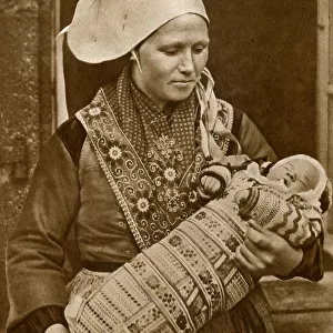 Breton woman with her baby, Brittany, Northern France