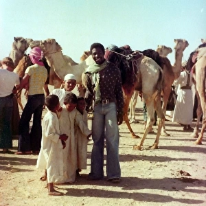 British Caribbean man with Omani children in Oman