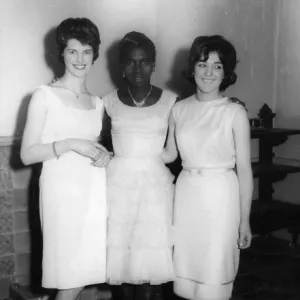 British Caribbean woman and two English women in white dress