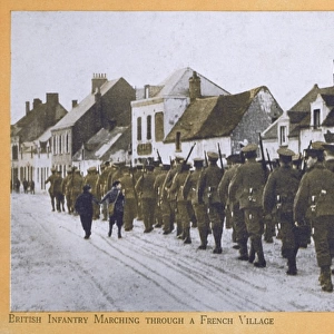 British Infantry march through a French Village - WWI