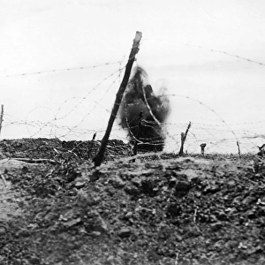 British shell bursting on German trenches, WW1