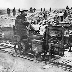 British soldier riding on light railway, WW1