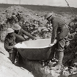 British soldiers find bath in abandoned German dugout, WW1