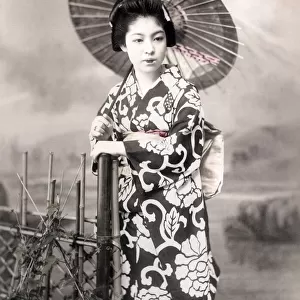 c. 1880s Japan - geisha with ornate kimono and parasol