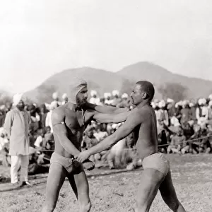 c. 1890s India - wrestlers taking part in a fighting bout