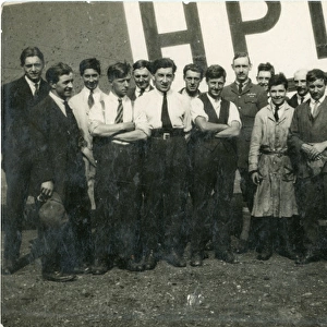Capt G. T. R. Hill (centre) with a group of mechanics in f?