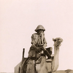 Captain Angus Buchanan on a camel in Mesopotamia