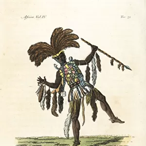Captain of the Ashanti in war dress of feathers