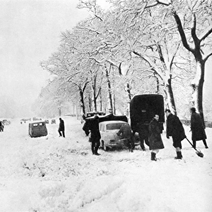 Cars stuck in snow at Pease Pottage, 1963