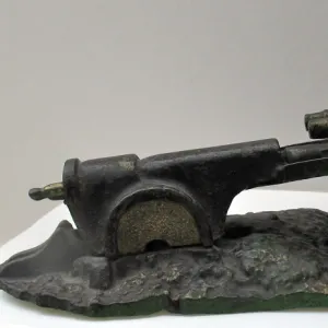 Cast Iron Starkies Patent Money Bank modelled as a cannon