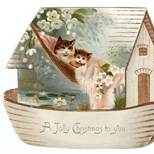 Two cats on a cutout Christmas card