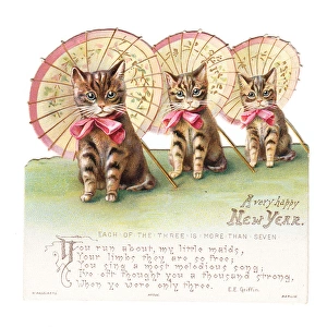 Three cats with parasols on a cutout New Year card