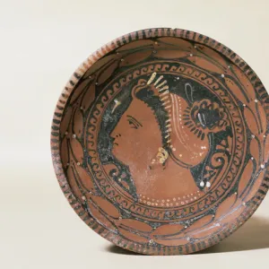 Ceramic plate. Decorated head matron. Greek imitation. 3rd c