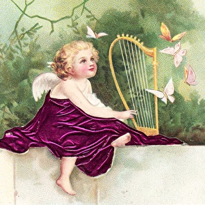 Cherub playing a harp on a greetings postcard