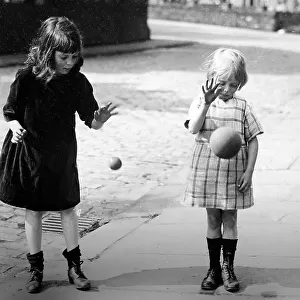 Children bouncing balls, early 1900s
