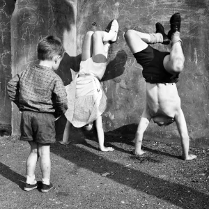 Children doing handstands on a Balham street, SW London