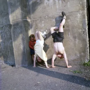 Children doing handstands on a Balham street, SW London