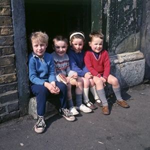 Children on doorstep in a Balham street, SW London