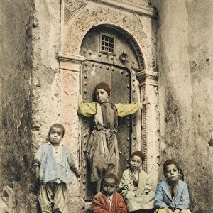Children by an ornate doorway
