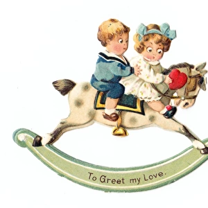 Two children on a rocking horse on a movable Valentine card
