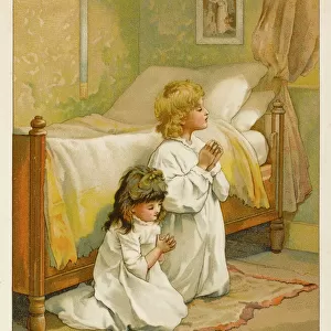 Two children saying their prayers before bed