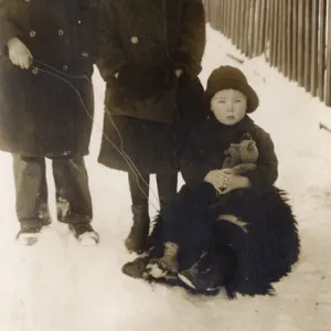 Three children in the snow, USA