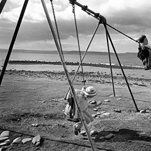 Children on swings, Arran, Scotland
