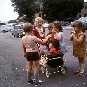 Children with toy pram, Balham, SW London