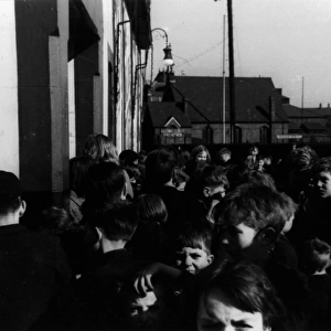 Children waiting outside cinema