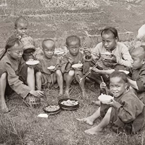 Chinese children eating with chopsticks, China c. 1890