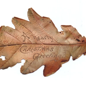 Christmas card in the shape of an autumn leaf