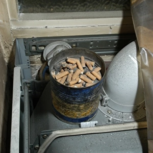 Cigarette butts in a tin