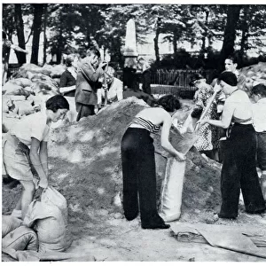 Civilians filling sandbags for air raid shelters 1939