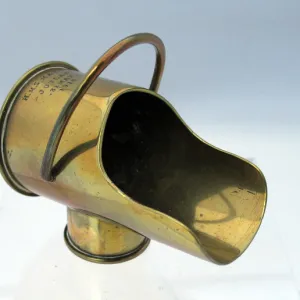 A coal-scuttle made from two types of shell cases