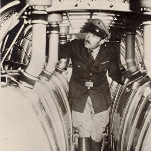 Col Roscoe Turner inspects the additional fuel tanks
