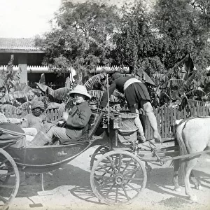 Colonial British men in carriage, India