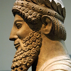 Colossal statue of a bearded man with laurel wreath. 500-480