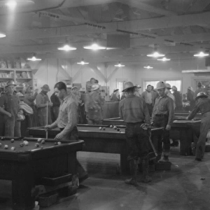Construction workers playing pool in company commissary, Sha