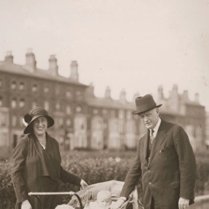 Couple / Baby in Pram 1920