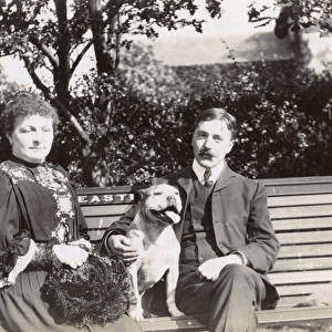 Couple on a bench with a dog